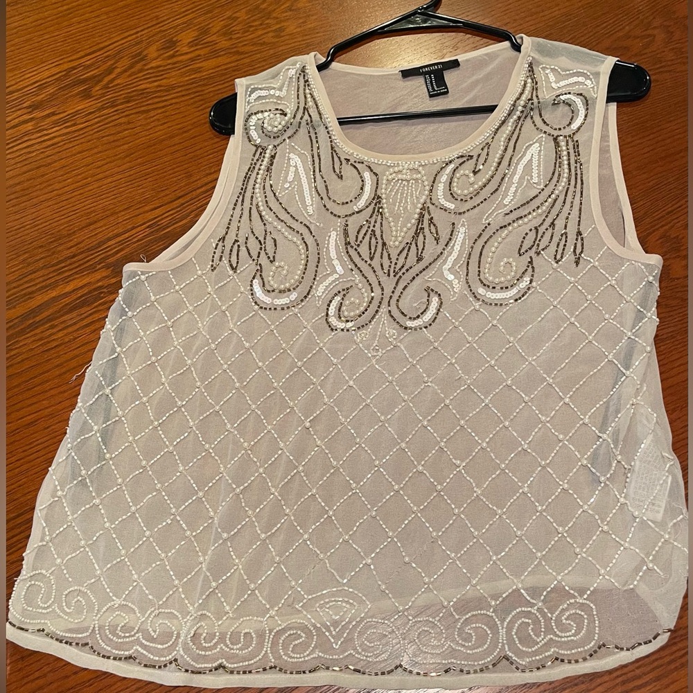 Sheer top, M, some pulled strings, more details on request